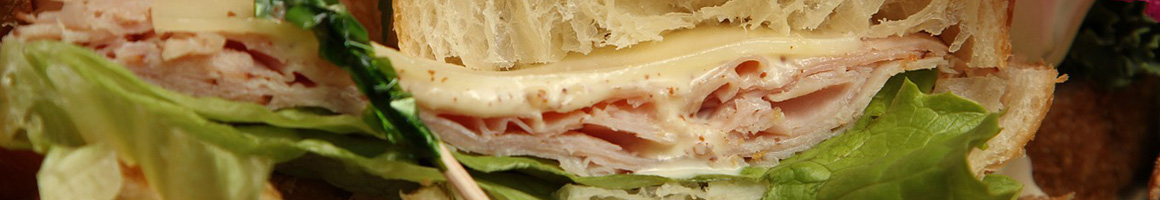 Eating Deli Sandwich at Oliver's Deli restaurant in Colorado Springs, CO.